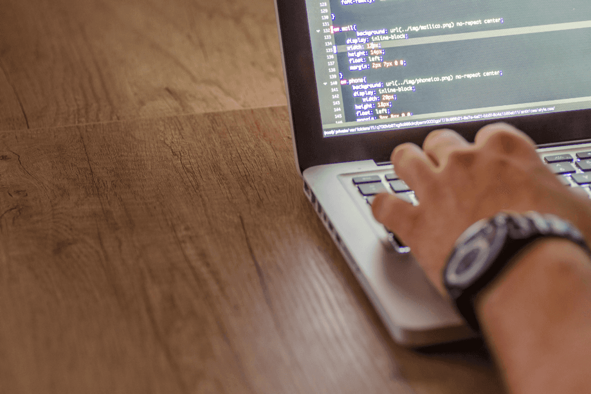 Pakistan's IT Exports Hit $435 Million in September 2026 — Second-Highest Ever 7 Close-up of hands typing code on a laptop