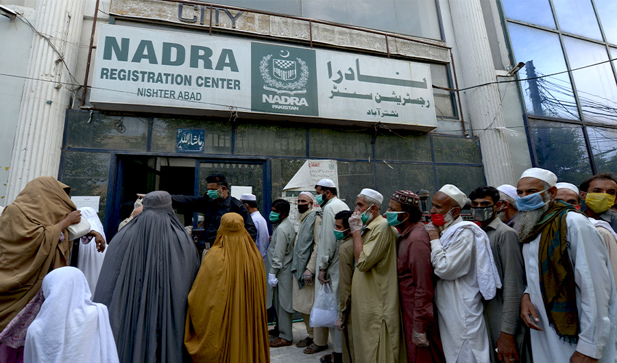 Citizens queue outside a NADRA registration centre