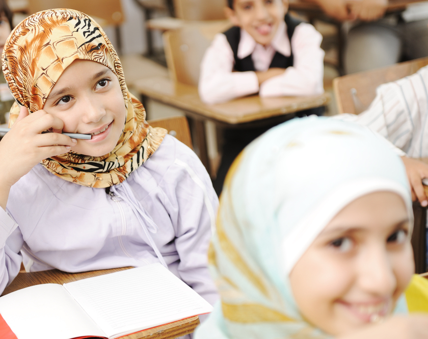 Azerbaijan School Hijab Ban Sparks Protests and Arrests as Enforcement Widens 6 Hijab-wearing schoolgirls sitting in a classroom