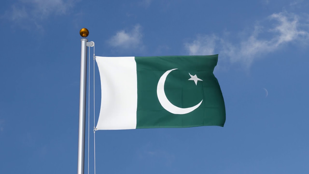 Pakistan's national flag flying against a blue sky