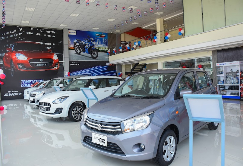 Pakistan Car Sales Jump 43% in Q1 FY27 as PAMA Data Shows Auto Market Revival 5 New Suzuki cars on display at a dealership showroom in Pakistan