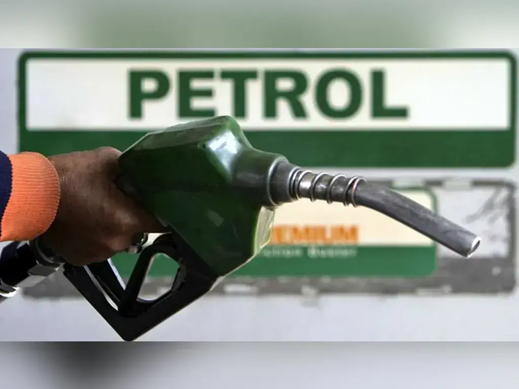 Petrol Cut by Rs3.93/L to Rs386.30, Diesel Unchanged — New Rates for Oct 17–19 6 Fuel nozzle at a petrol pump with the PETROL sign in the background