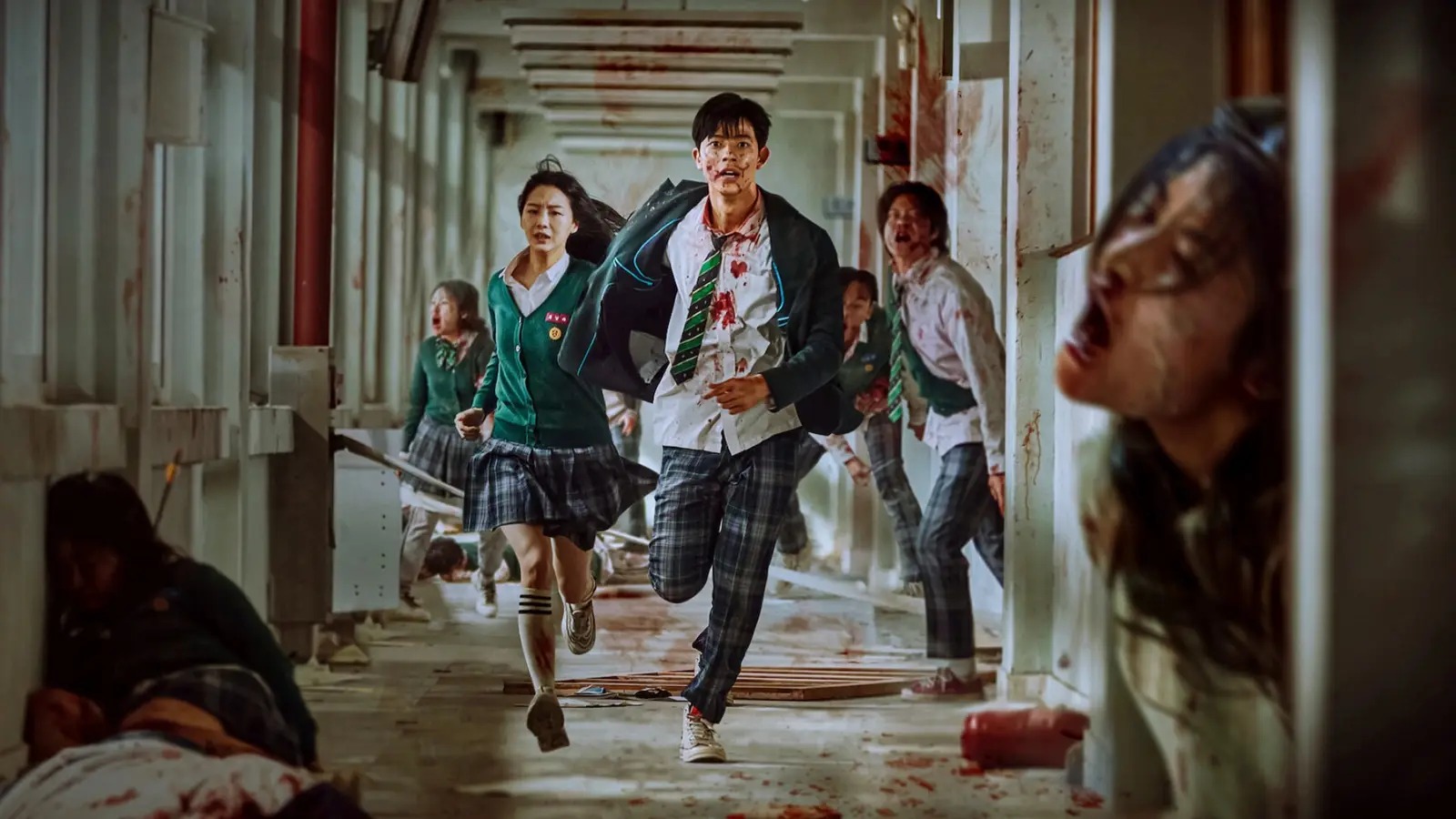 Students fleeing through a school corridor in Netflix's All of Us Are Dead