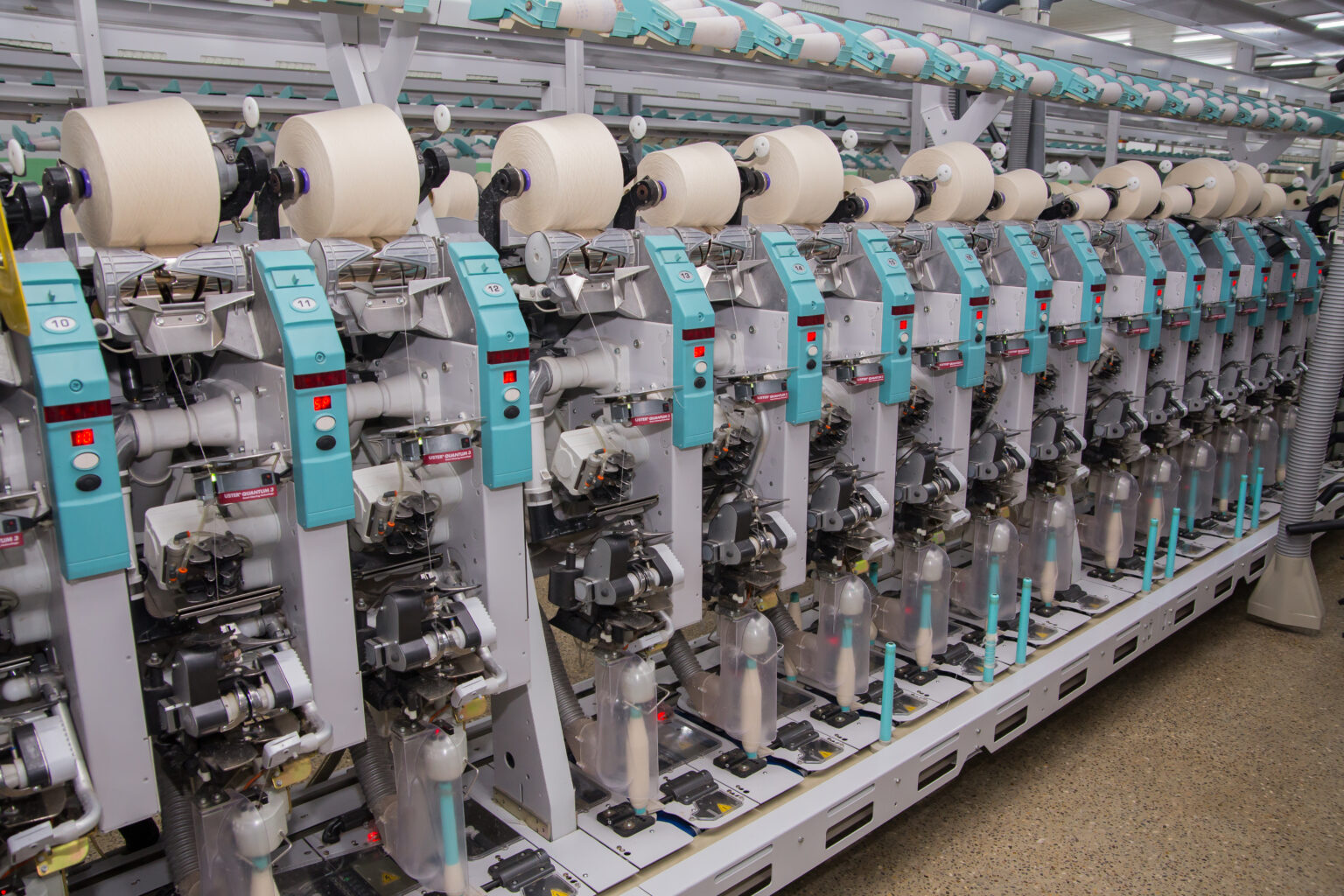 Pakistan Textile Exports Rise 5.26% to $5.03 Billion in Q1 FY27 — Garments Lead the Charge 6 Modern spinning machines with yarn cones in a Pakistani textile mill