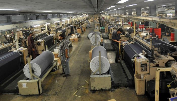 Pakistan Textile Exports Rise 5.26% to $5.03 Billion in Q1 FY27 — Garments Lead the Charge 5 Inside a Pakistani textile weaving mill with fabric rolls on industrial looms